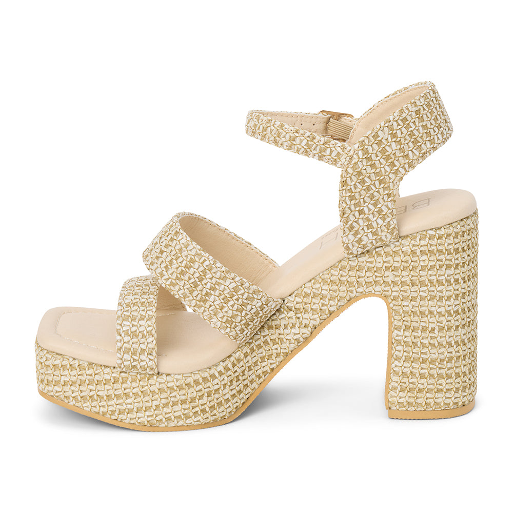 Beige platform heel sandal with woven vegan raffia texture, ankle strap, and chunky heel, shown on a white background.