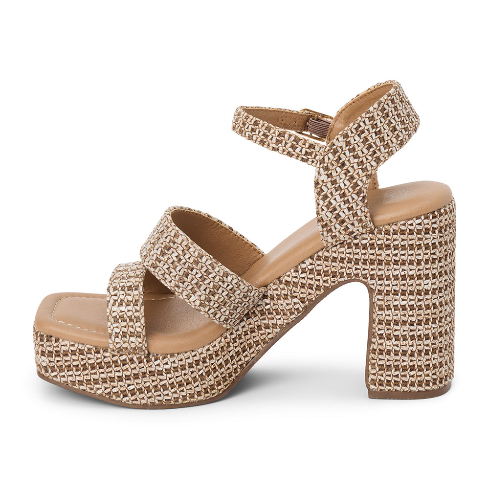 Brown platform heel sandal with woven vegan raffia texture, ankle strap, and chunky heel, shown on a white background.