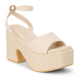 Ivory faux leather platform sandal with wide front strap, adjustable ankle strap, chunky woven platform heel, and open toe, shown on a white background.