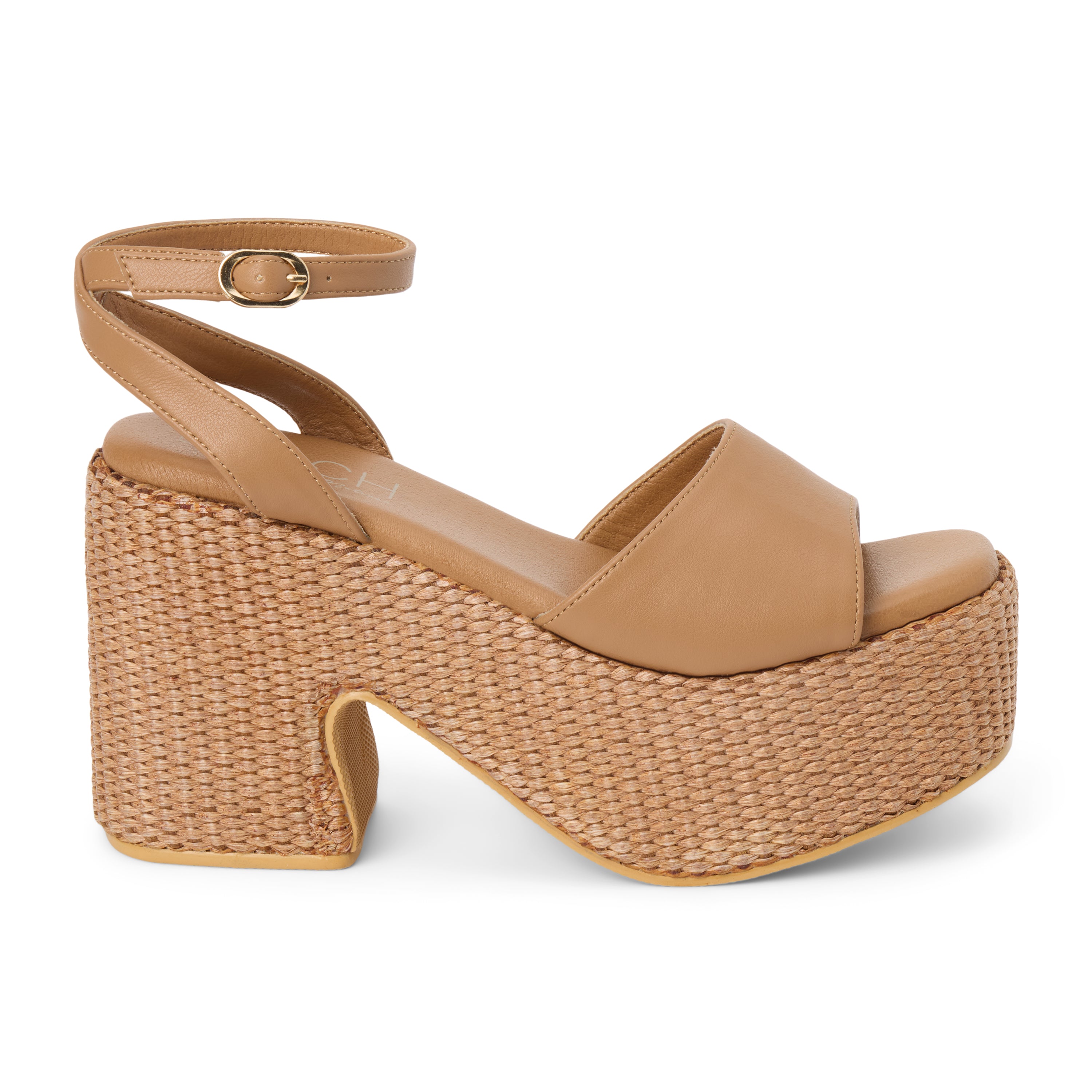 Cognac faux leather platform sandal with wide front strap, adjustable ankle strap, chunky woven platform heel, and open toe, shown on a white background.