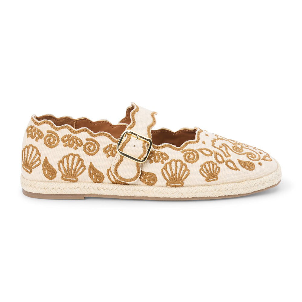 Tan embroidered canvas flat with scalloped edges and buckle strap shown on a white background.