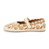 Tan embroidered canvas flat with scalloped edges and buckle strap shown on a white background.
