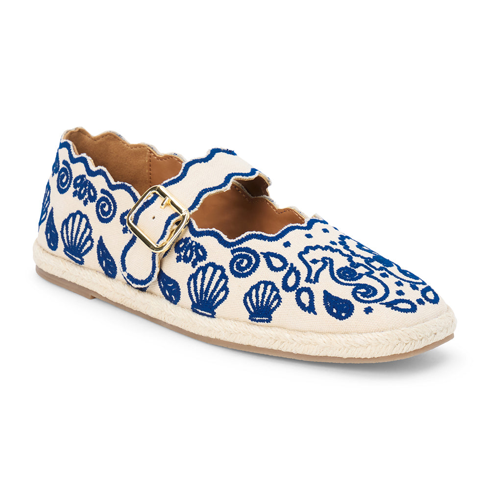 Blue embroidered canvas flat with scalloped edges and buckle strap shown on a white background.