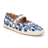 Blue embroidered canvas flat with scalloped edges and buckle strap shown on a white background.