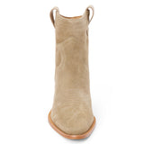 Taupe suede ankle boot with western stitching, a pointed toe, stacked heel, and pull tab, shown in side profile on a white background.