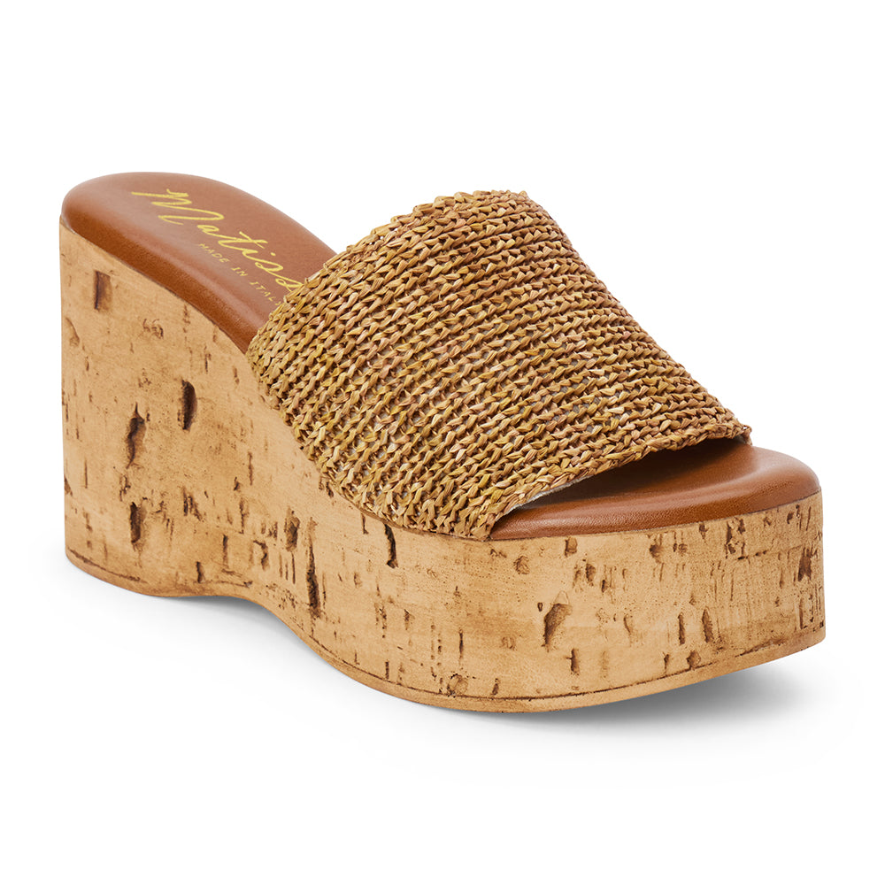 Tan raffia platform sandal with cork wedge and wide strap shown on a white background.