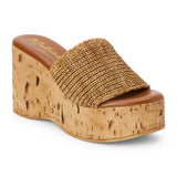 Tan raffia platform sandal with cork wedge and wide strap shown on a white background.