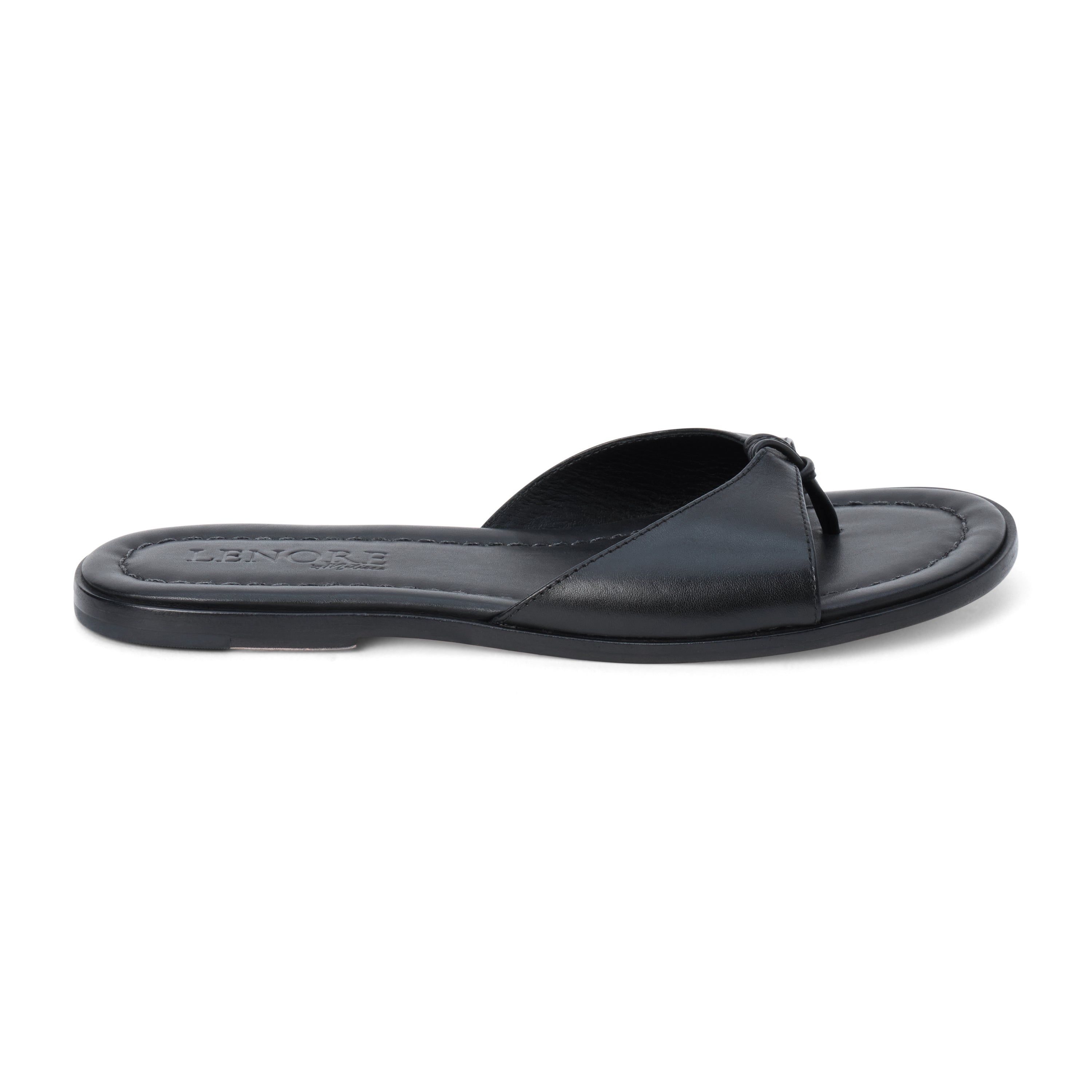 Black leather flat sandal with minimalist thong strap and padded footbed, shown on a white background.