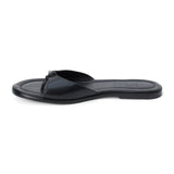 Black leather flat sandal with minimalist thong strap and padded footbed, shown on a white background.
