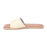 Light yellow leather slide sandal with a wide single strap and flat sole, shown on a white background.