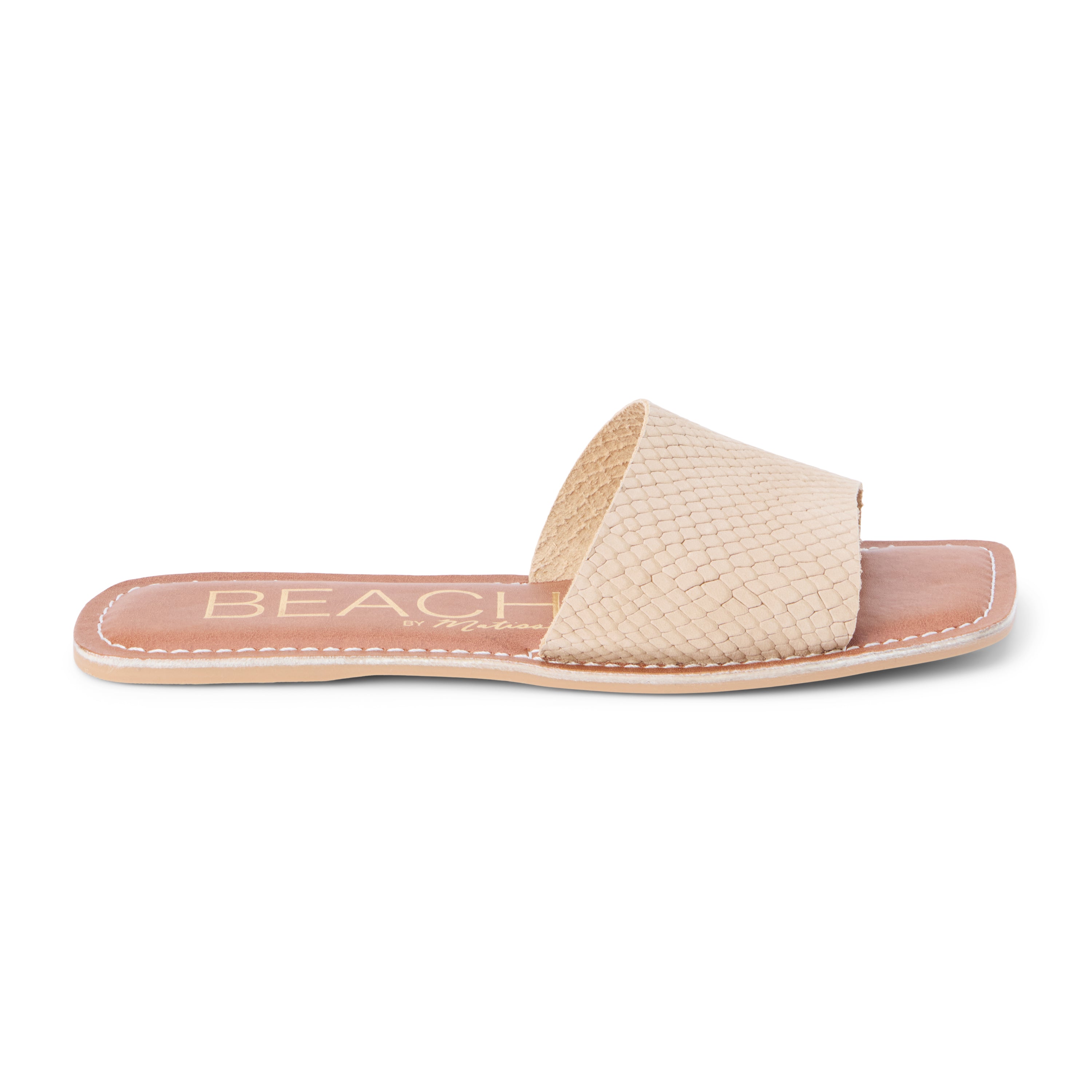 Tan suede slide sandal with a wide single strap and flat sole, shown on a white background.