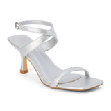 Silver faux leather heeled sandal with slim ankle strap, open square toe, mid-height heel, and buckle closure, shown on a white background.