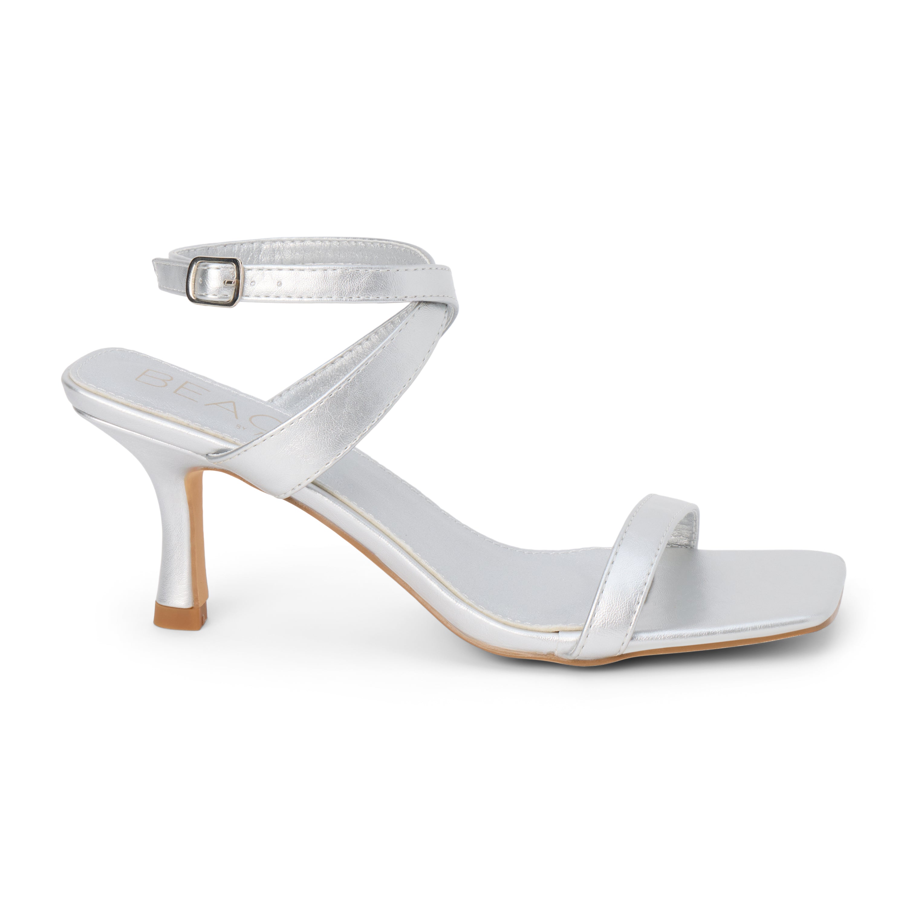 Silver faux leather heeled sandal with slim ankle strap, open square toe, mid-height heel, and buckle closure, shown on a white background.