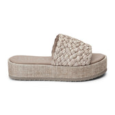 A laid-back staple, these natural raffia platform sandals feature a woven upper and a cushioned footbed. The textured platform sole adds subtle height while keeping things comfortable.