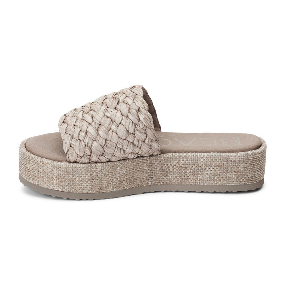 A laid-back staple, these natural raffia platform sandals feature a woven upper and a cushioned footbed. The textured platform sole adds subtle height while keeping things comfortable.