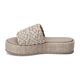 A laid-back staple, these natural raffia platform sandals feature a woven upper and a cushioned footbed. The textured platform sole adds subtle height while keeping things comfortable.