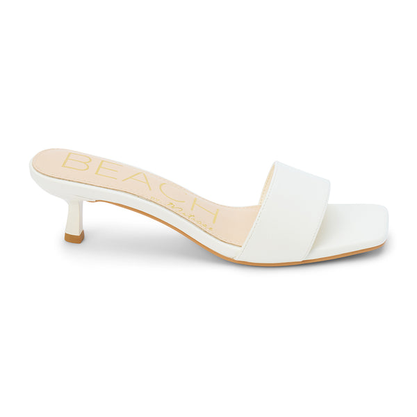 Minimalist and chic, these white kitten heel mules feature a sleek square toe, soft faux leather upper, and a comfortable low heel. A versatile staple for effortless elegance.