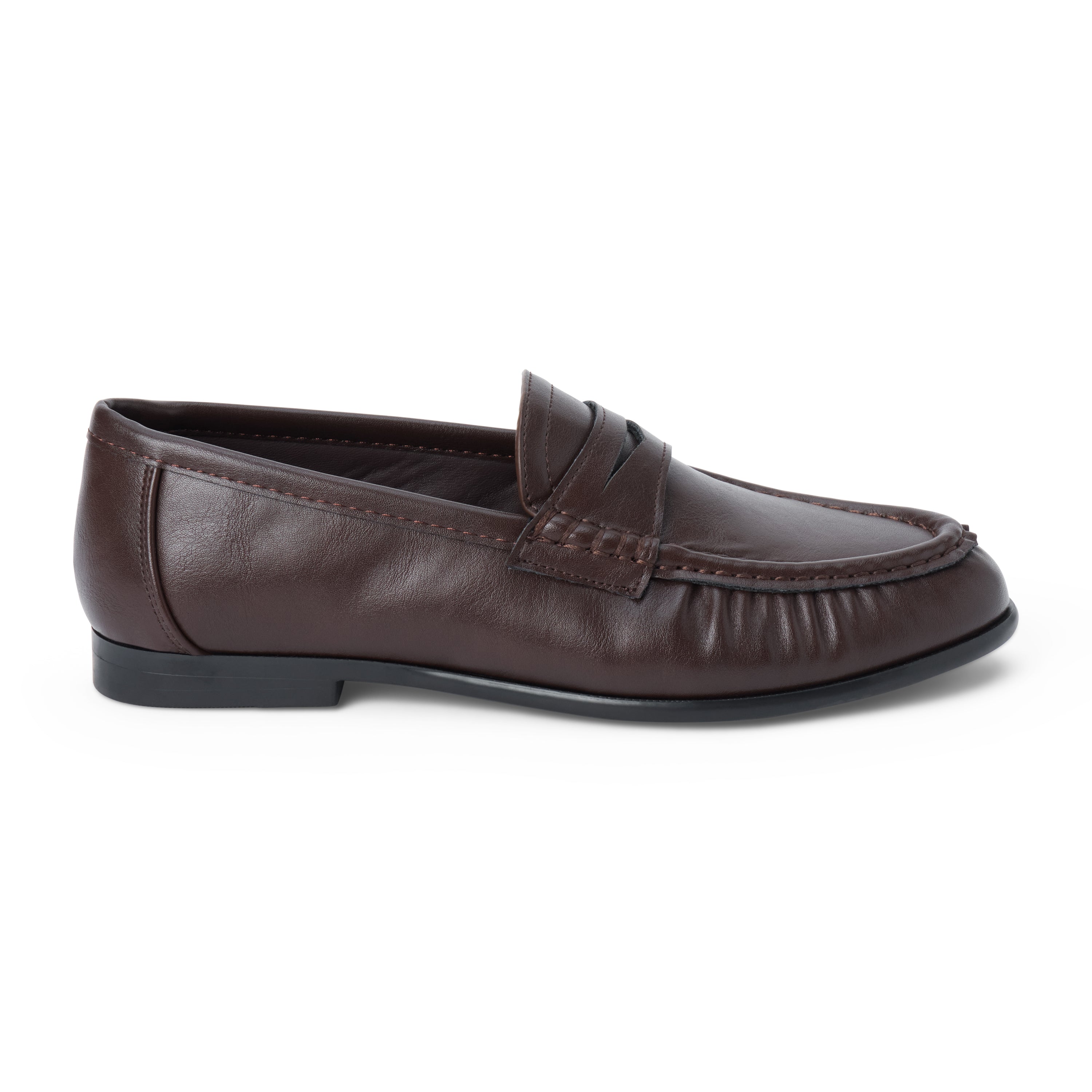 Vegan brown faux leather penny loafer with a penny strap, moc-toe stitching, gathered toe detail, and black low heel shown on a white background.