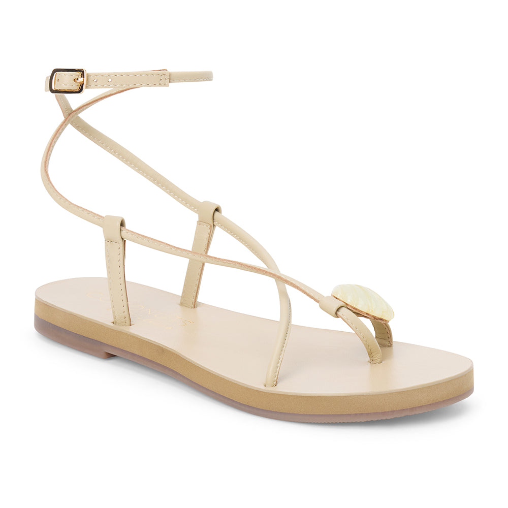 Ivory leather sandal with thin straps and wraparound ankle strap shown on a white background.