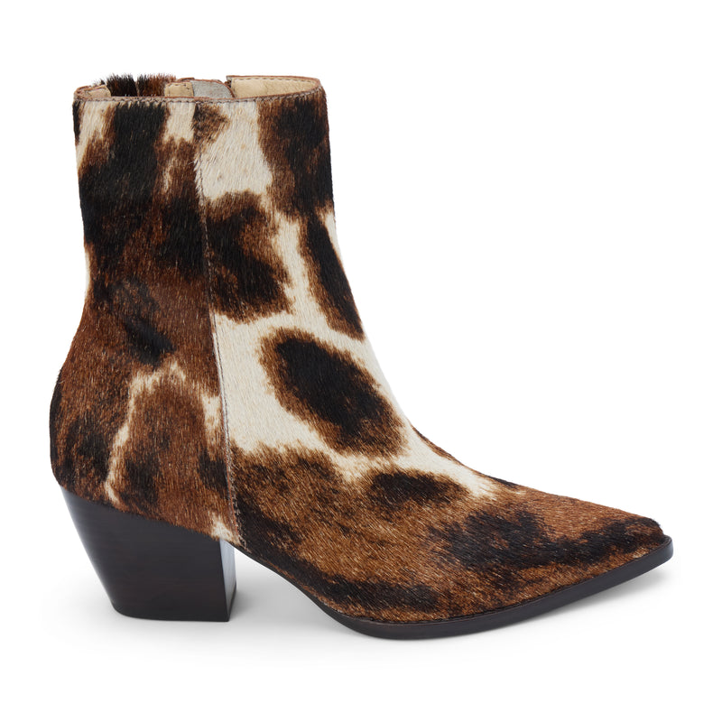 Caty Ankle Boot – Matisse Footwear – Cow-print haircalf ankle boot with a pointed toe, stacked block heel, and side zipper. A bold Western-inspired silhouette with statement-making texture.
