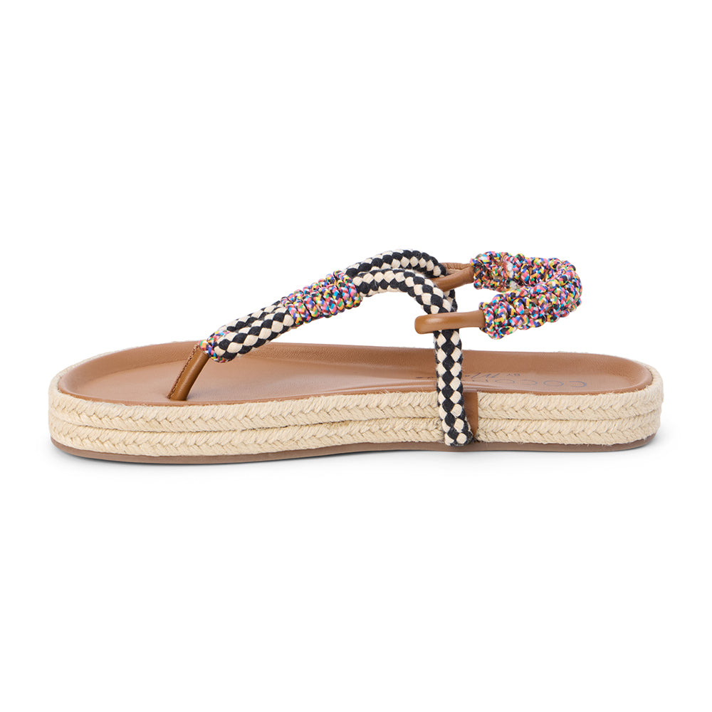 Black and white braided thong sandal with multicolor accents and flat sole shown on a white background.