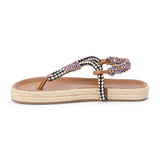Black and white braided thong sandal with multicolor accents and flat sole shown on a white background.