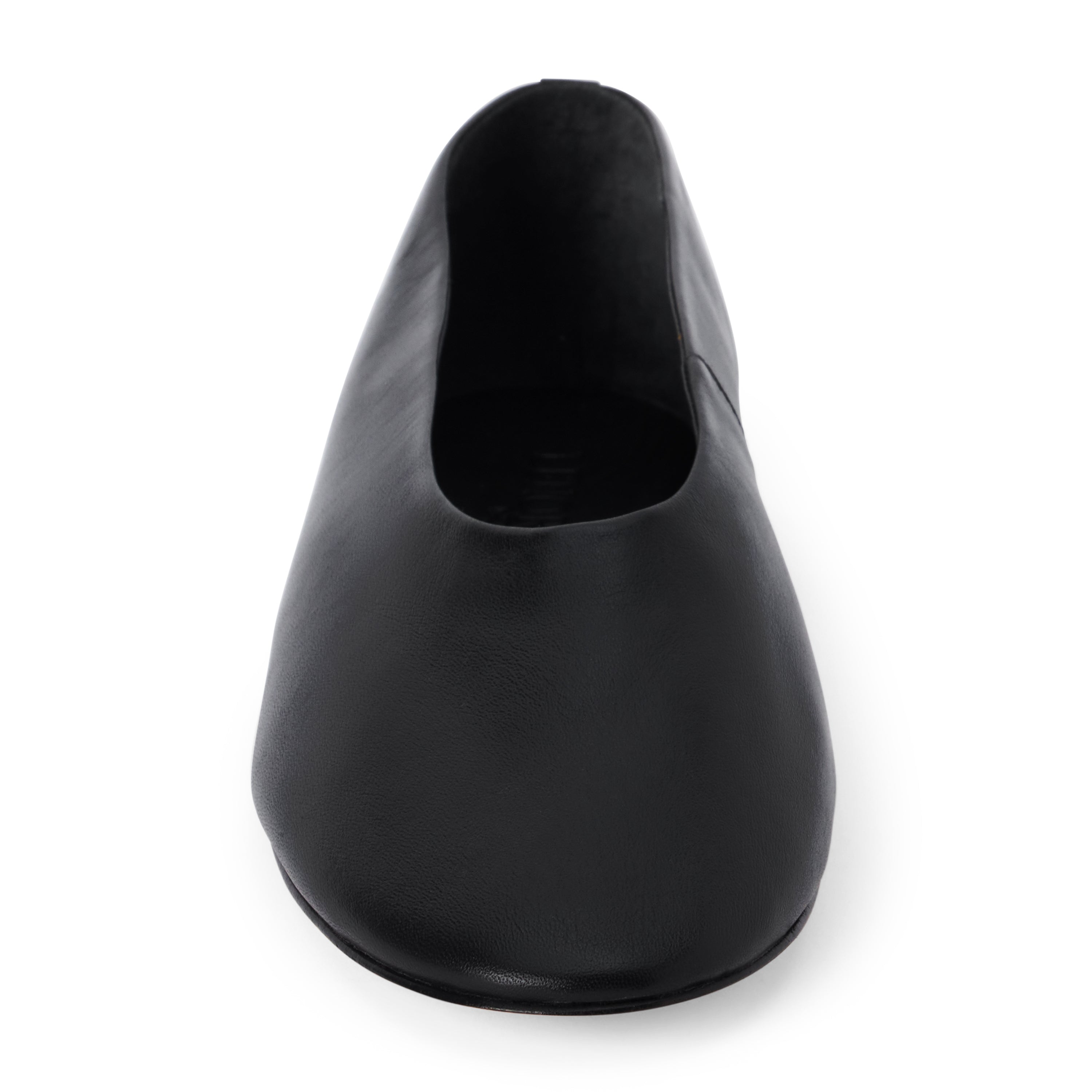 Black leather flat with a softly squared toe, high-cut vamp, smooth upper, and low black heel shown on a white background.