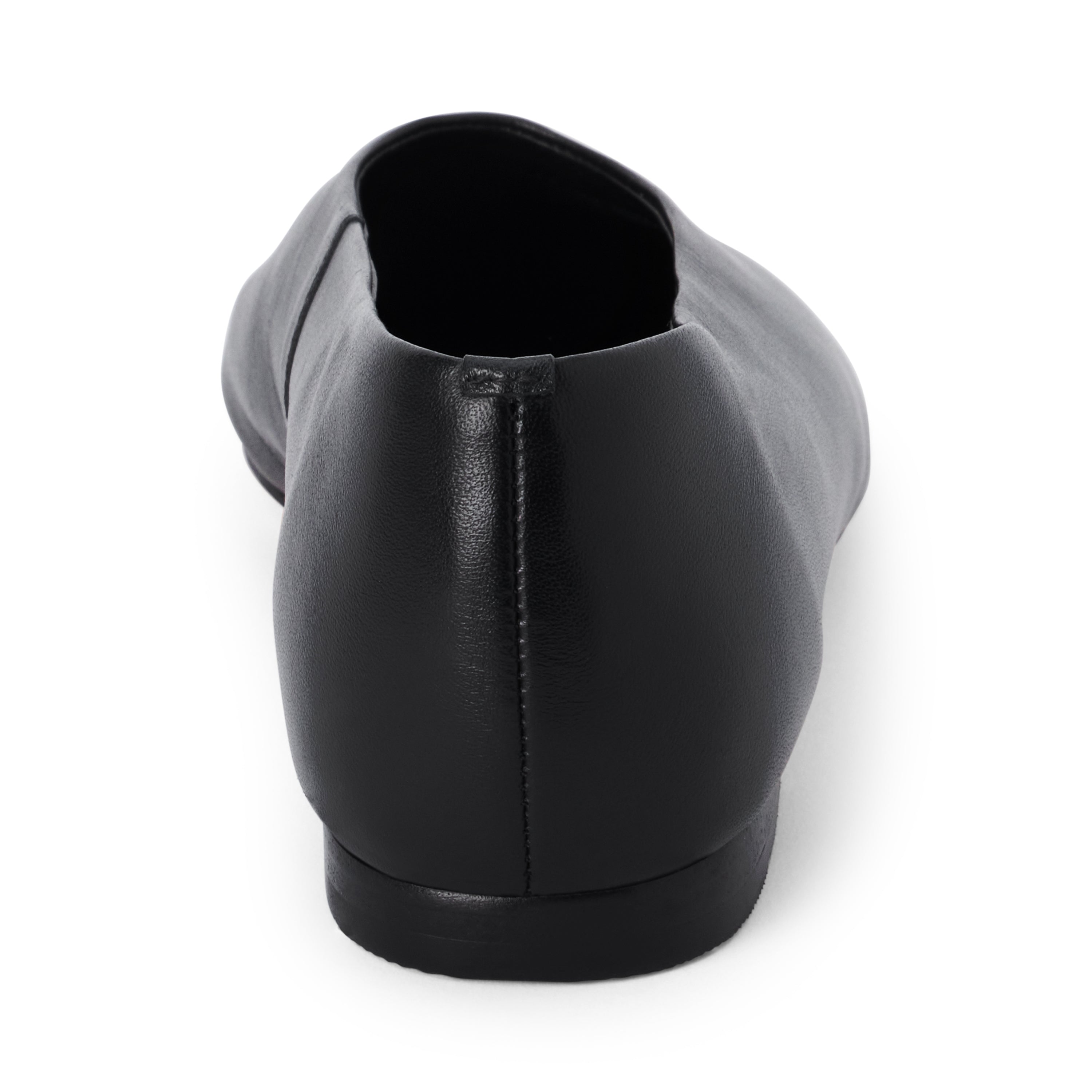 Black leather flat with a softly squared toe, high-cut vamp, smooth upper, and low black heel shown on a white background.