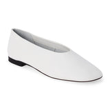 White leather flat with a softly squared toe, high-cut vamp, smooth upper, and low black heel shown on a white background.
