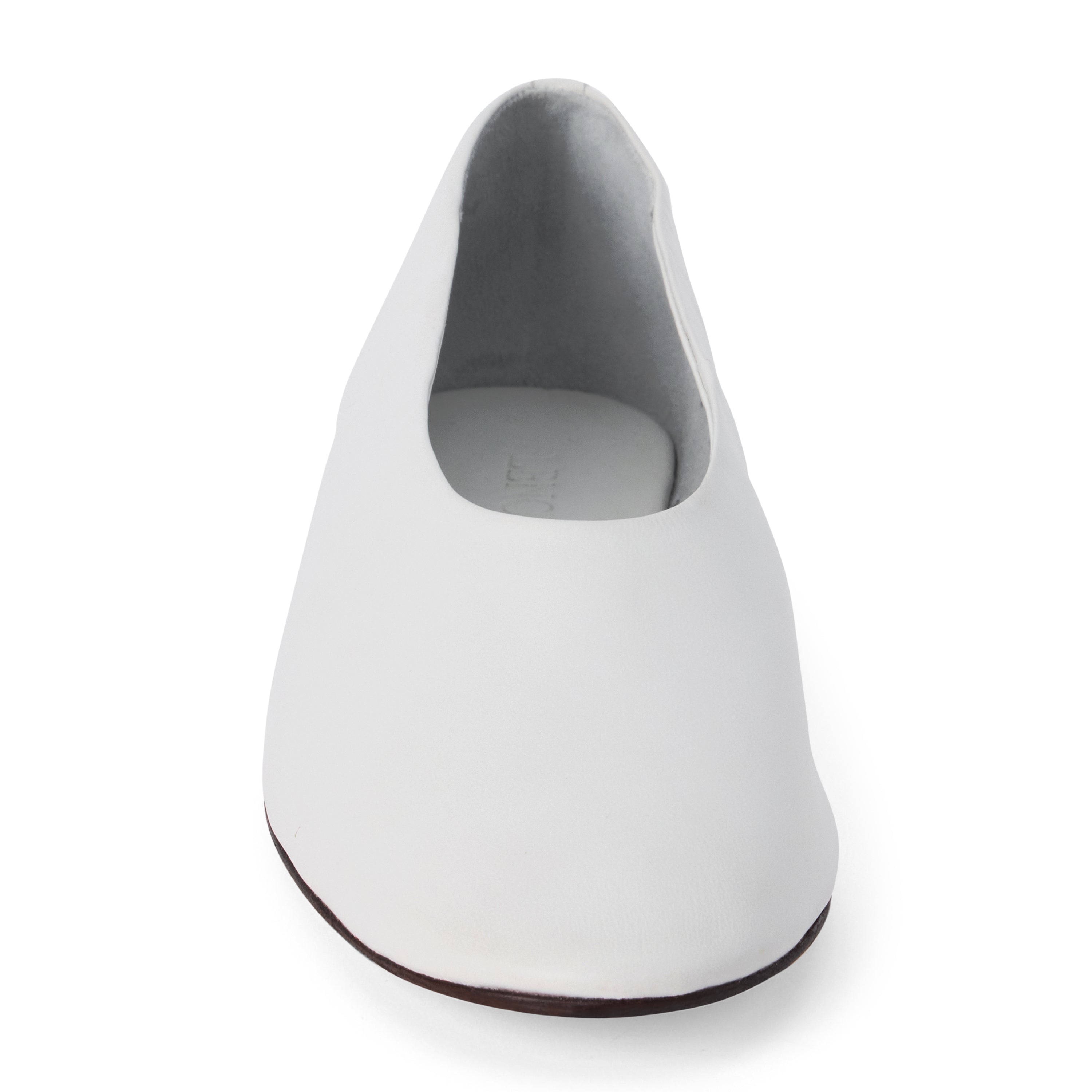 White leather flat with a softly squared toe, high-cut vamp, smooth upper, and low black heel shown on a white background.