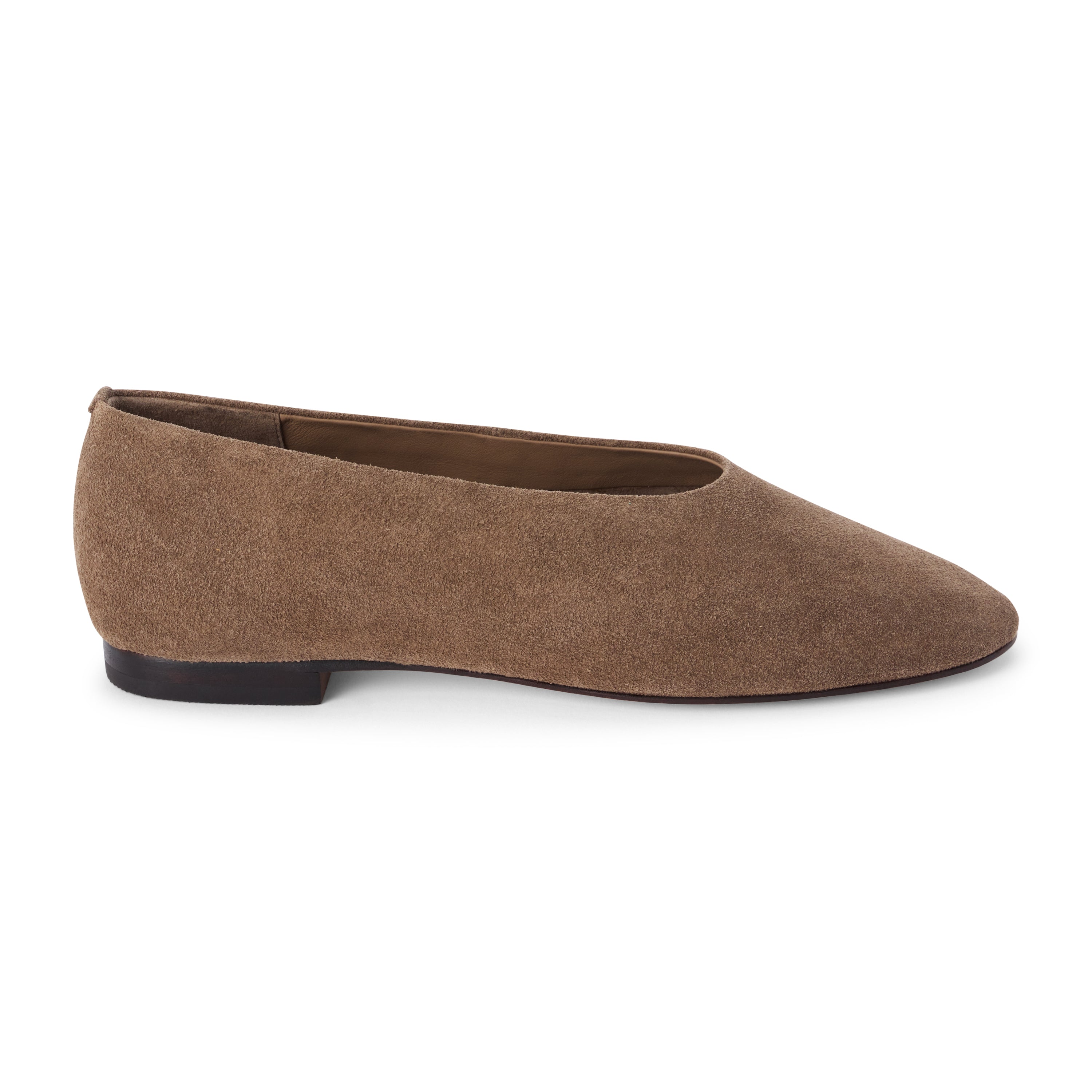 Brown suede flat with a softly squared toe, high-cut vamp, textured upper, and low dark heel shown on a white background.