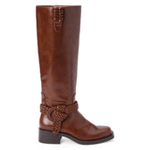 Brown faux leather knee-high boot with a rounded toe, low block heel, and braided wraparound ankle detail shown on a white background.