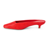 Red cow hair heeled mule with a pointed toe and low kitten heel shown on a white background.