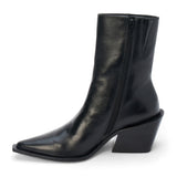 Black leather ankle boot with a pointed toe, angled block heel, and smooth minimalist upper shown on a white background.