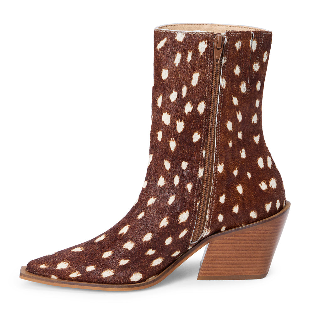 Brown and ivory spotted cow hair ankle boot with a pointed toe and angled block heel shown on a white background.