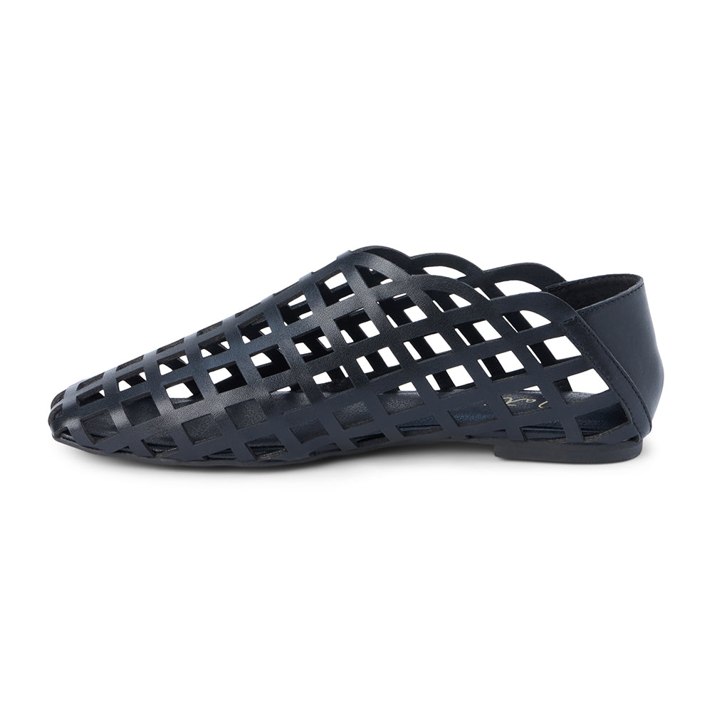 Black woven leather flat with a cage-style upper, almond toe, low profile sole, and closed heel, shown in side profile on a white background.