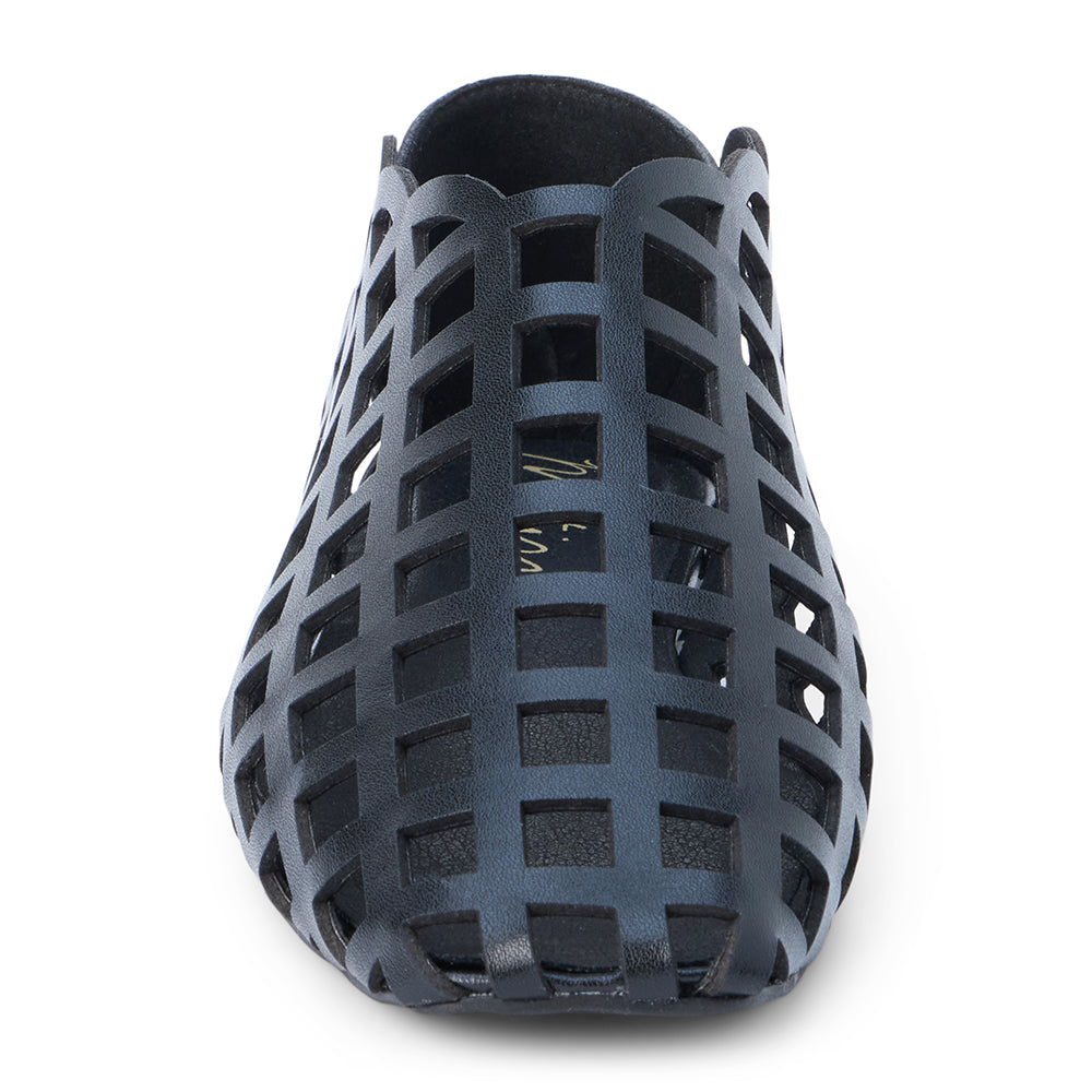 Black woven leather flat with a cage-style upper, almond toe, low profile sole, and closed heel, shown in side profile on a white background.