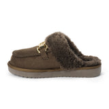 Vegan brown faux suede mule with plush faux-fur trim, gold-tone hardware, a moc toe, and platform sole shown on a white background.