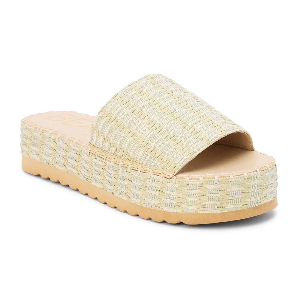 Green and ivory platform slide sandal with woven vegan raffia upper and thick sole, shown on a white background.