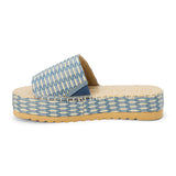 Blue and ivory platform slide sandal with woven vegan raffia upper and thick sole, shown on a white background.