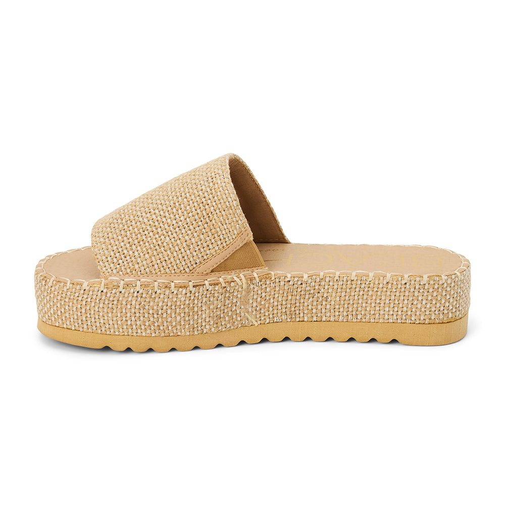 Gold platform slide sandal with woven vegan jute upper and thick sole, shown on a white background.