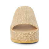 Gold platform slide sandal with woven vegan jute upper and thick sole, shown on a white background.