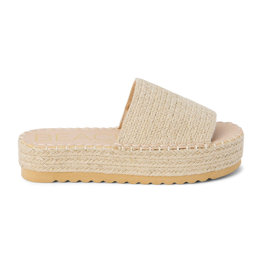Ivory platform slide sandal with woven vegan jute upper and thick sole, shown on a white background.
