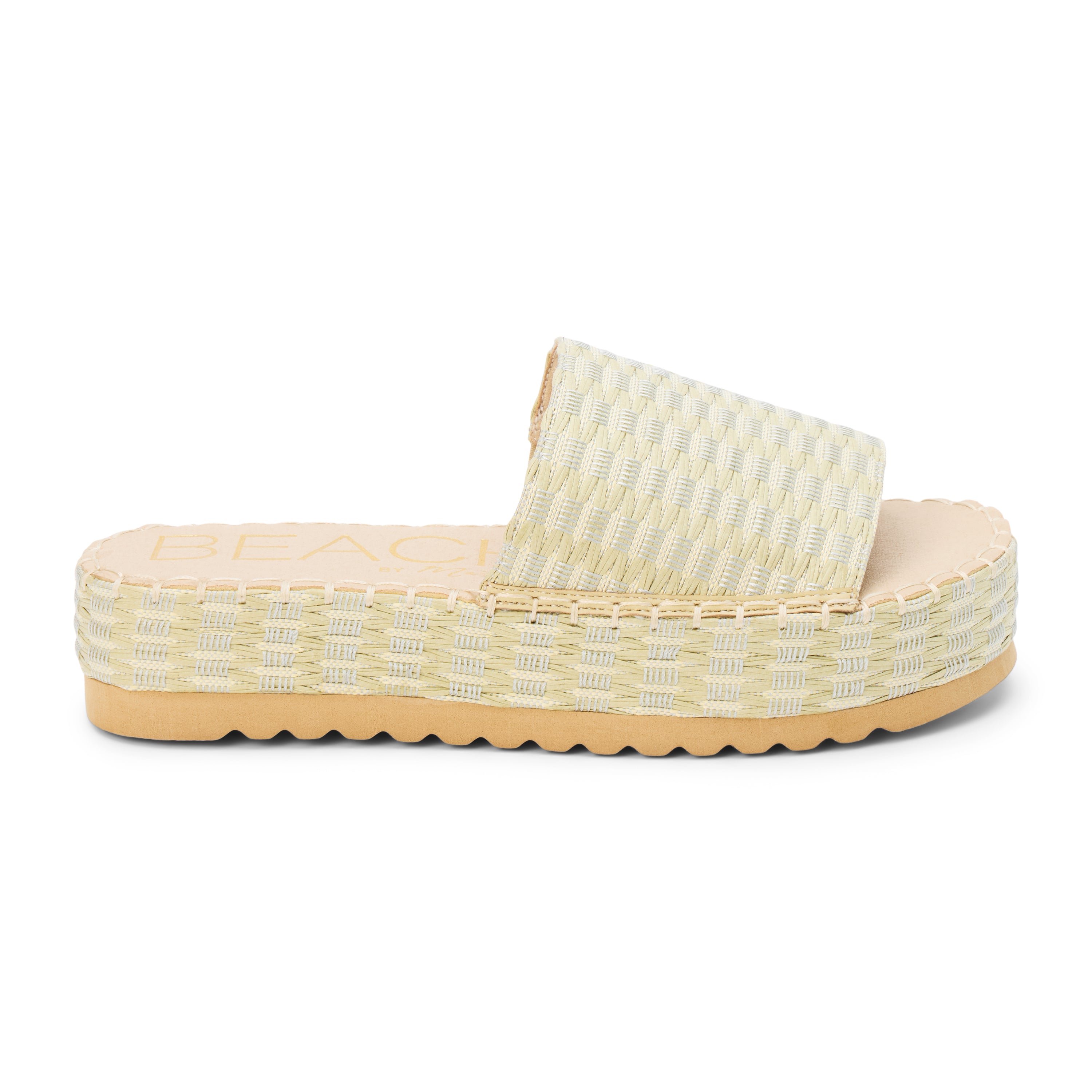 Green and ivory platform slide sandal with woven vegan raffia upper and thick sole, shown on a white background.