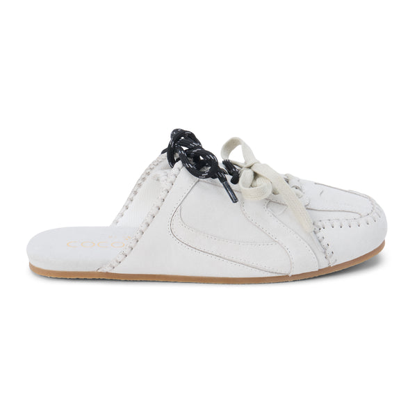 Devyn Sneaker Mule – Coconuts by Matisse – Light grey suede mule with moccasin-style stitching, sporty lace-up detail, and open back. A laid-back hybrid silhouette blending slipper comfort with sneaker edge.
