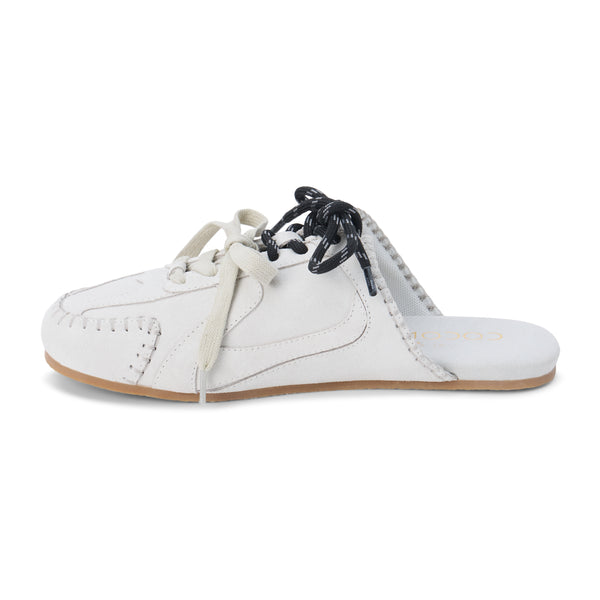 Devyn Sneaker Mule – Coconuts by Matisse – Light grey suede mule with moccasin-style stitching, sporty lace-up detail, and open back. A laid-back hybrid silhouette blending slipper comfort with sneaker edge.