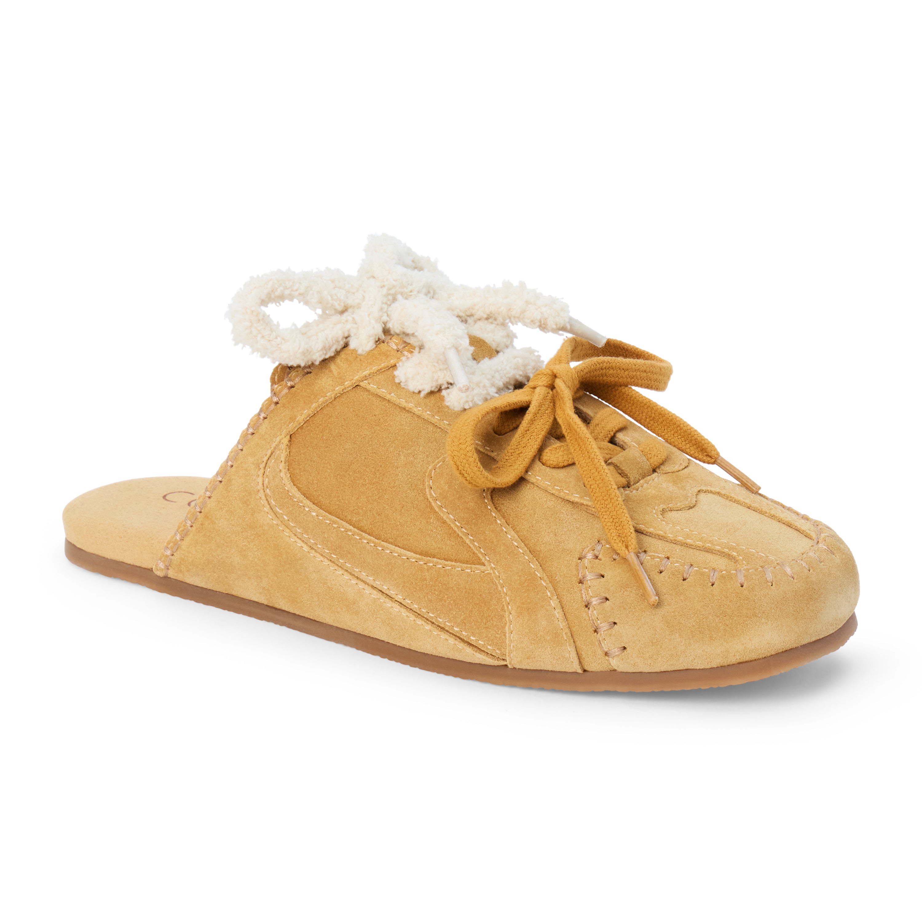 Tan suede sneaker mule with ivory shearling trim, tan laces, stitched detailing, and a flat sole shown on a white background.