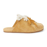 Tan suede sneaker mule with ivory shearling trim, tan laces, stitched detailing, and a flat sole shown on a white background.