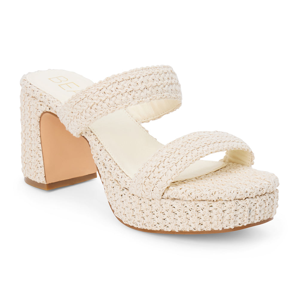 Ivory woven platform sandal with dual straps and a chunky block heel, shown on a white background.