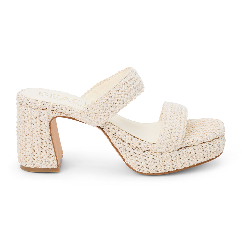 Ivory woven platform sandal with dual straps and a chunky block heel, shown on a white background.